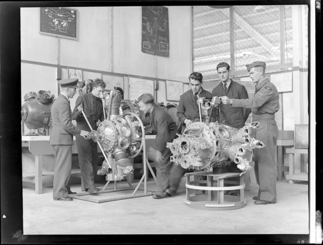 Instruction on single and twin Pratt and Whitney Wasp engines. Flying Officer W J Haughton, officer I C engines, AC2 J E Berdineer, AC2 M R Braithwaite, AC2 S W Beck, AC2 W T Baguley, and Flight Sergeant H Dickson BEM, Hobsonville Technical Training School