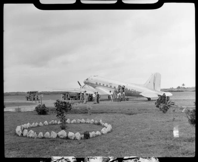 Passengers at Naursori Airport, boarding the airplane ZK-APA 'Puweto', NZNAC (New Zealand National Airways Corporation), Fiji