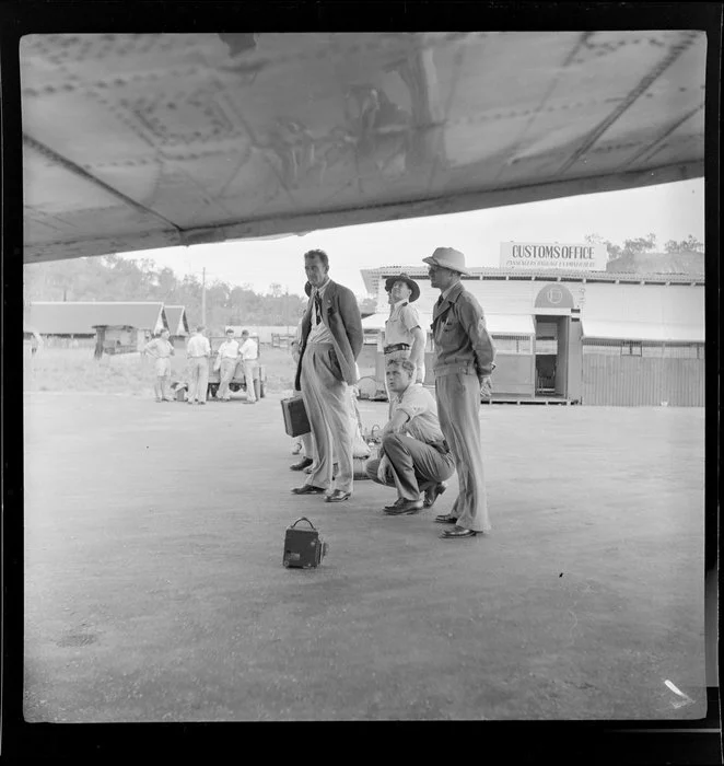 Officials, awaiting the arrival of a DC-3, Bird of Paradise service, Qantas Empire Airways, Port Moresby, Papua New Guinea