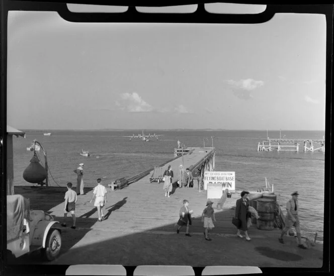 Passengers alighting on dock at Flying Boat Base, Darwin