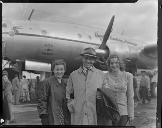 Passengers Mr Esdaile and daughters having disembarked from Qantas Constellation Ross Smith at Whenuapai Royal New Zealand Air Force base