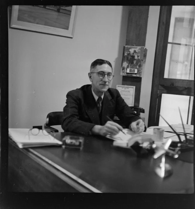 Wilmot Hudson Fysh (Qantas Chairman) at his desk [Qantas headquarters, Mascot, Sydney, Australia?]