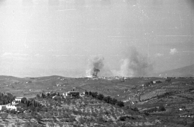 Smoke rising from the bombs and shells being showered on the enemy stronghold at San Casciano, one of the key points before Florence