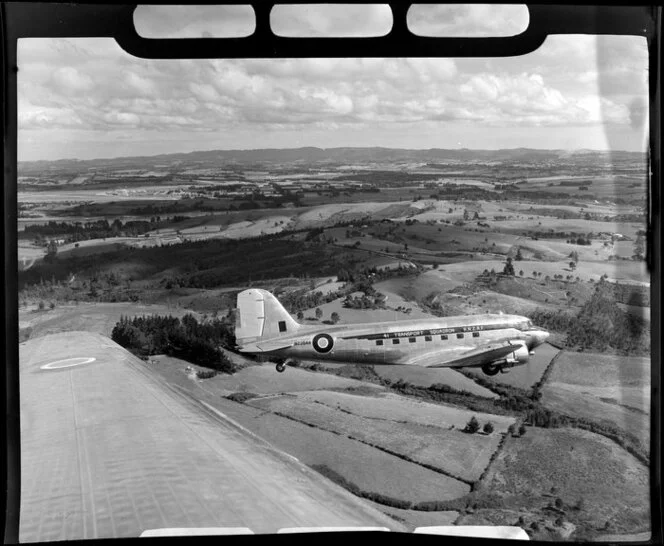 RNZAF (Royal New Zealand Air Force) 41 Squadron, Dakota airplane in flight over Whenuapai airbase, Waitakere City, Auckland