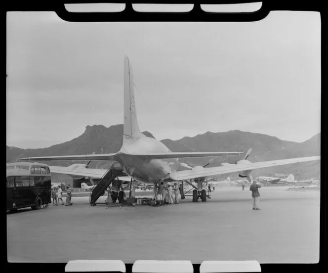 Airport staff loading freight and luggage into British Overseas Airways Corporation aircraft G-ALHP, Kai Tak airport, Kowloon, Hong Kong