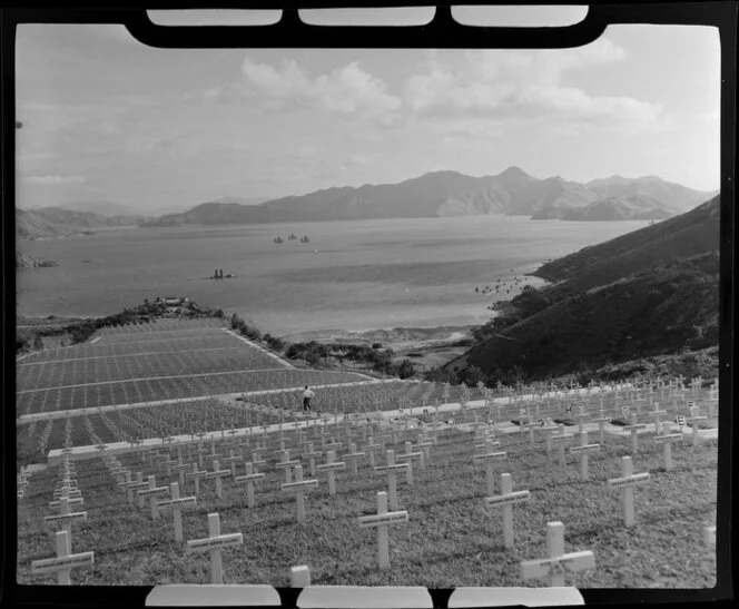 Sai Wan Bay War Cemetery overlooking the bay, with rows of white crosses down the hillside, Hong Kong