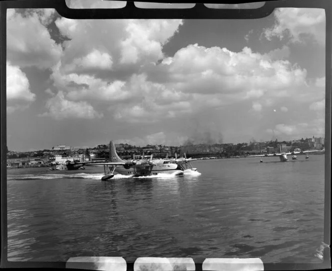 Tasman Empire Airways Ltd aircraft taking off, Mechanics Bay, Auckland