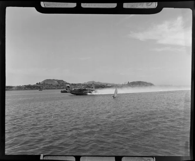 Tasman Empire Airways Ltd aircraft taking off, Mechanics Bay, Auckland