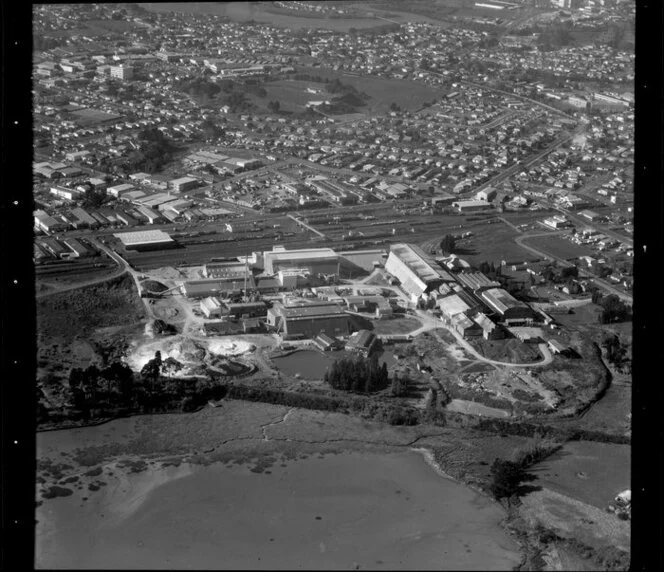 Unidentified [limestone?] factory in industrial area, Manukau City, Auckland, including [Mangere Inlet?]