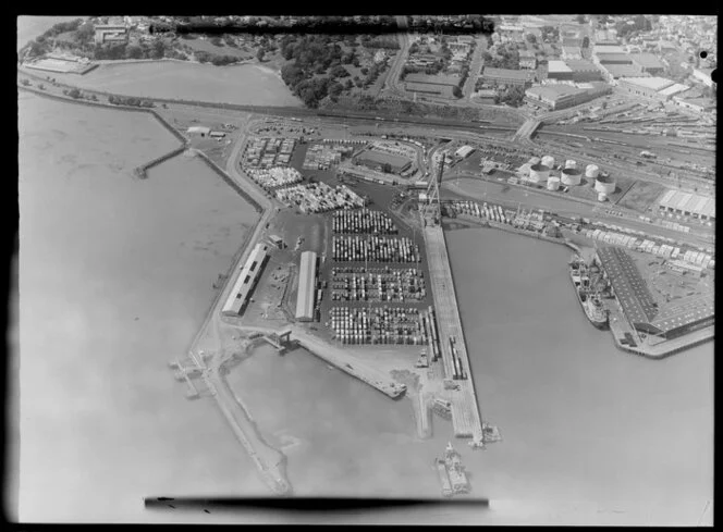 Containers and ships at Fergusson Wharf, Port of Auckland, Waitemata Harbour, including Parnell Baths and Main Trunk Line