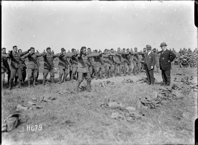Members of the Pioneer Battalion performing a haka for ministers Massey and Ward, Bois-de-Warnimont, France