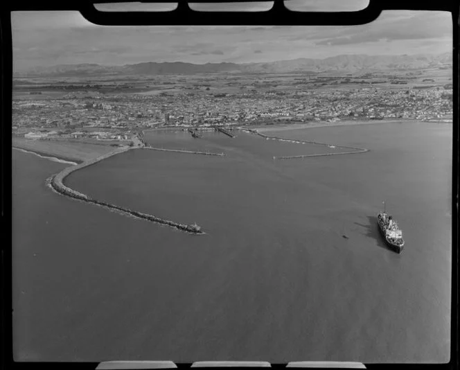 Timaru, South Canterbury, showing town, harbour and ship Mahia departing