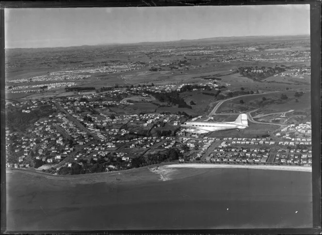 New Zealand National Airways Corporation (NAC) Flagship Dakota aircraft in flight over Auckland