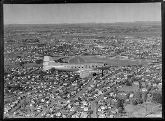 New Zealand National Airways Corporation (NAC) Flagship Dakota aircraft in flight over Auckland