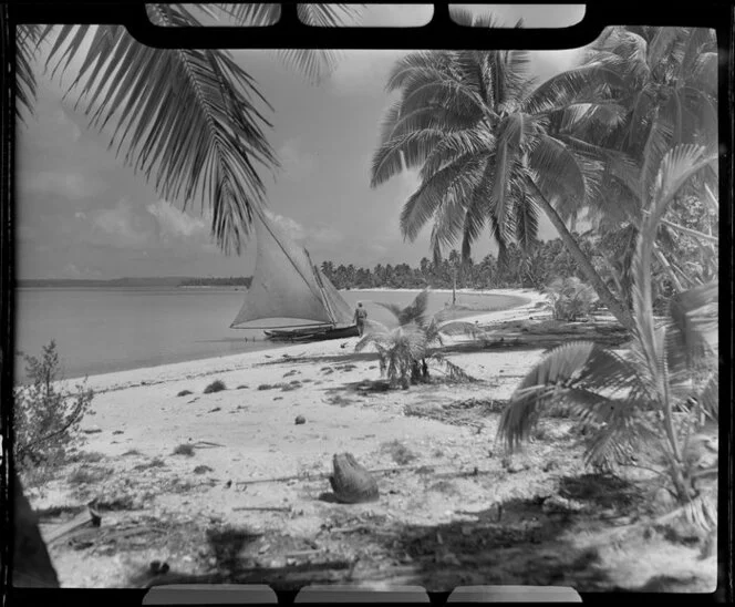Akaiami beach, Aitutaki, Cook Islands, showing sail boat and native trees