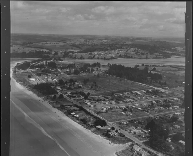 Orewa, Rodney County, Auckland, showing houses, roads and coastline