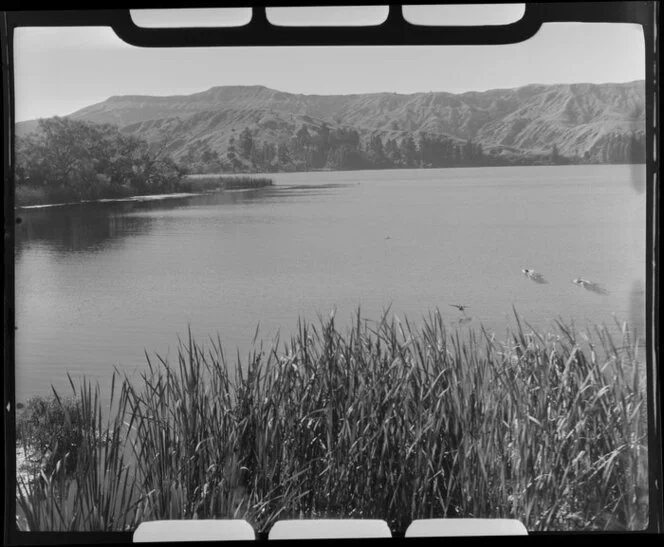 Lake Tutira, Hawke's Bay, showing hills in the distance