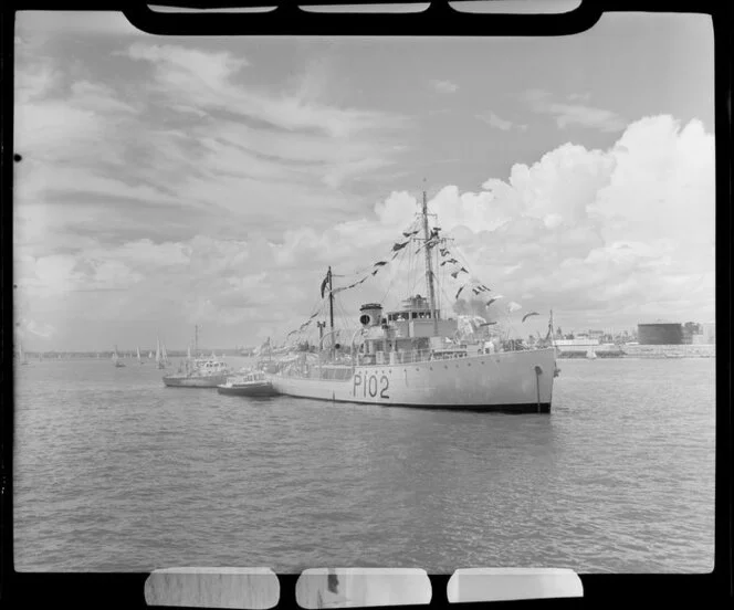 Auckland Anniversary Regatta, Auckland Harbour, showing large ship and smaller boats