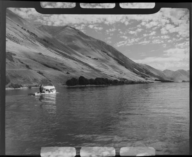 Lake Ohau, Waitaki District, Canterbury Region, showing charter boat and mountains in the background