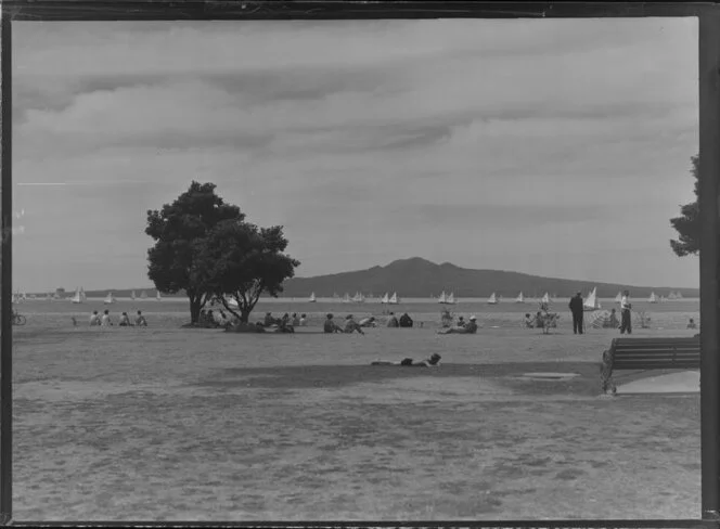 Mission Bay, Auckland, showing people on beach and Rangitoto Island