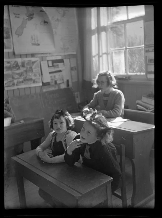 Children from Weheka School sitting at desks, West Coast Region