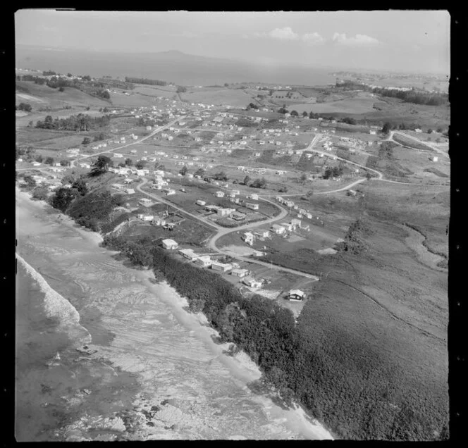 Stanmore Bay, Whangaparaoa Peninsula, Auckland Region, showing houses and beach