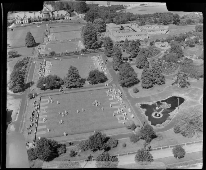 Government Gardens, Rotorua, showing players on lawn bowling greens, Blue Baths and The Bath House (later known as Rotorua Museum)