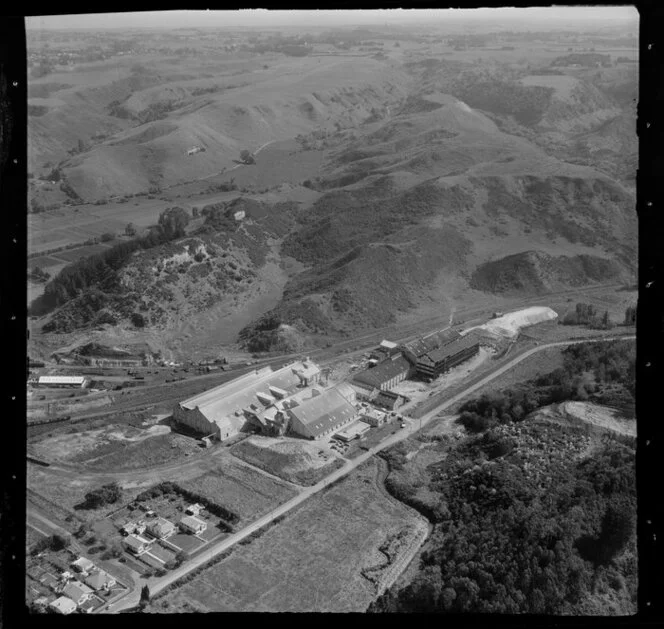 Wanganui, closeup view over Kempthorne Prosser Chemical Works between Brunswick Road and railway yard, hilly farmland beyond
