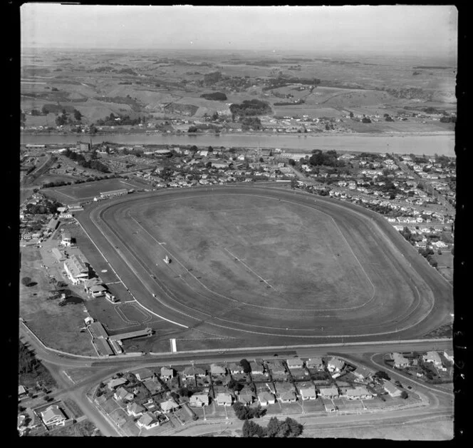 Wanganui, Gonville, showing racecourse and Spriggens Park and Jacksons Street with residential housing, with the Whanganui River and farmland beyond