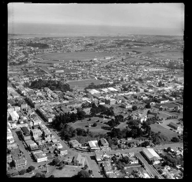 Wanganui, showing Queens Park Domain, Ridgway Street, Bell Street with commercial and residential buildings, looking towards the racecourse and Castlecliff beyond