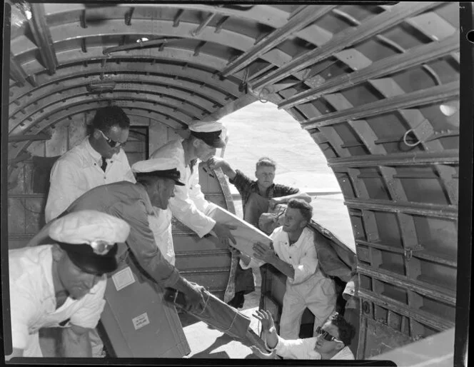 National Airways crew unloading freight from aircraft, Whenuapai, Waitakere City, Auckland