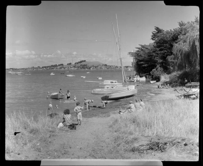 Beach at Onehunga, Auckland, people enjoying themselves in the water