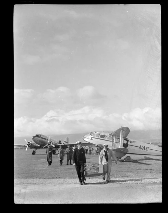 National Airways, Westport, showing two pilots and a Dominie-Dakota aircraft