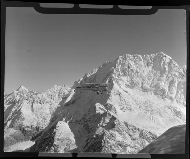 Mount Cook and Southern Lakes aircraft, Auster ZK-BOX in flight over Mount Cook region, Southland