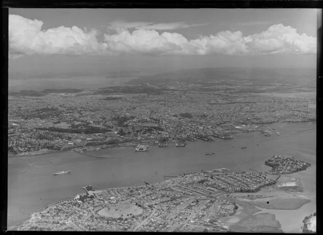 Auckland city from North Shore, showing harbour and wharves in foreground