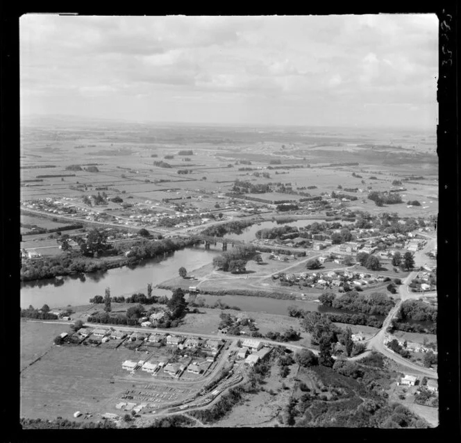 Ngaruawahia, Waikato, view south to town at the confluence of the Waikato River with bridge and Waipa River with Waingaro Road Bridge, with residential housing and farmland beyond