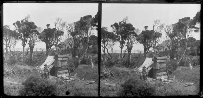 Unidentified elderly man sitting outside coastal shack [campsite?], Catlins area, Clutha District, Otago Region