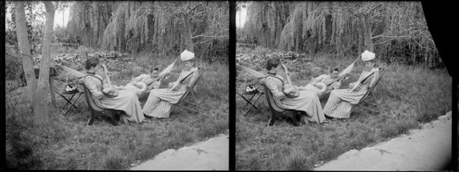 Group of women, including Lydia Myrtle Williams (in hammock) and Miss Rowbottom of Shakespeare Terrace (on right), who are playing banjos in garden at photographer William and Lydia Williams' Carlyle Street house, Napier, Hawkes Bay Region
