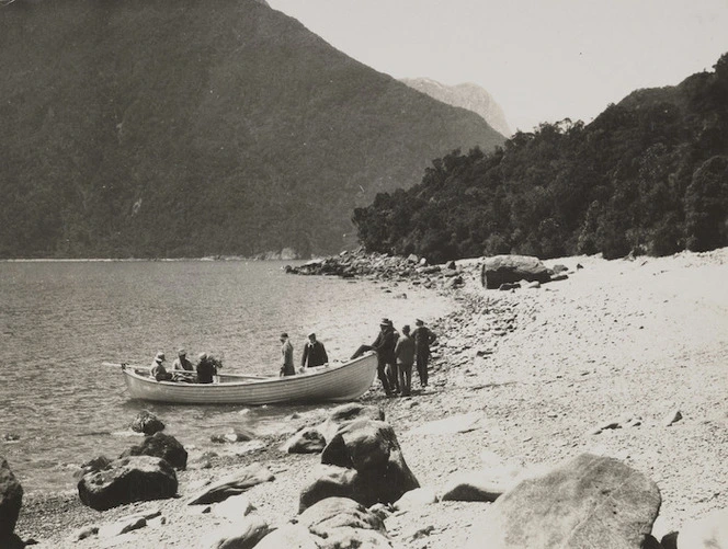 Group of men disembarking from a boat, Greenstone Gully, West Coast Region