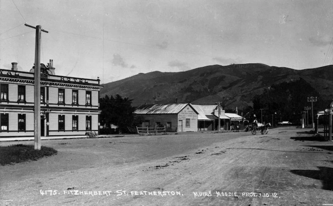 Looking along Fitzherbert Street, Featherston. In view is the garage of Arthur W Harmer and part of the Royal Hotel