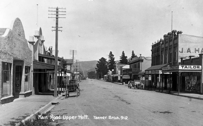 Main Street, Upper Hutt, showing the firm of J Finlay, tailor