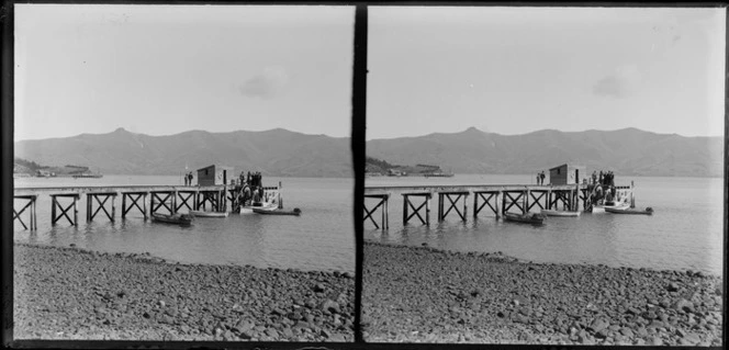 Akaroa wharves, including passengers boarding a small boat, Banks Peninsula