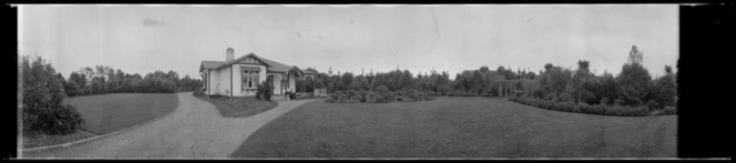 [Wooden villa, grounds and trees.]