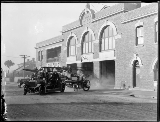 Christchurch Fire Station, with firemen on fire trucks leaving the station