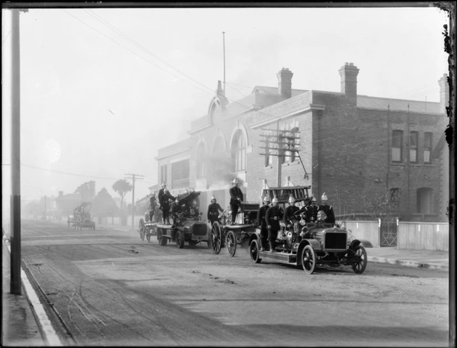 Firemen and ladders on fire engines outside the fire station, Christchurch