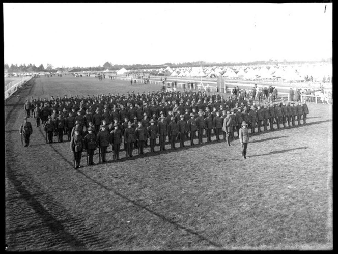 New Zealand Infantry soldiers on parade in camp, [Trentham?], with tents in the background