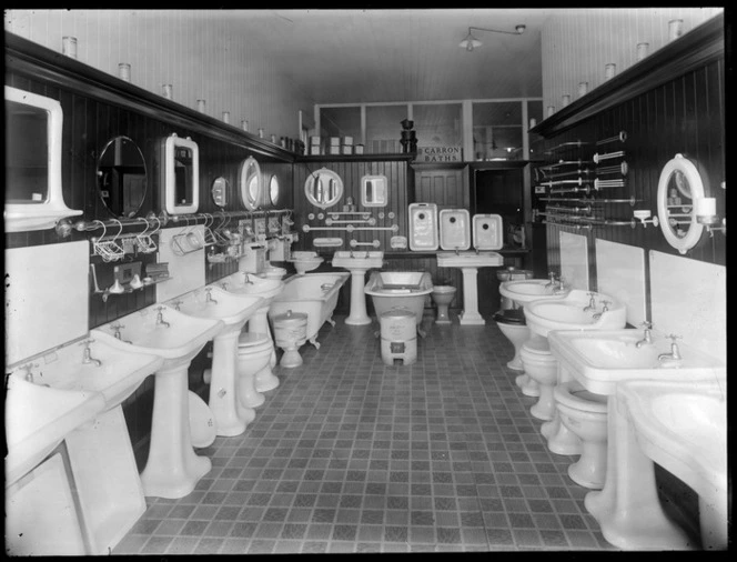Interior of a bathroom showroom displaying ceramic toilets, wash basins and baths, possibly Christchurch
