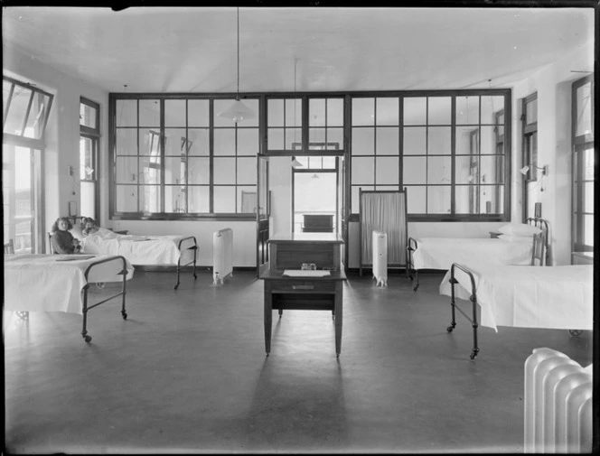 Interior of King George V Coronation Memorial Hospital, Christchurch, showing a ward and including a child in bed