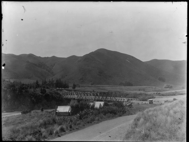 Banks Peninsula, Canterbury, showing bridge and tents pitched by stream