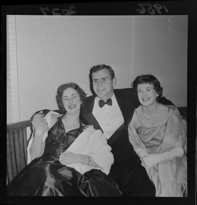 1956 Springbok rugby union football tour, unidentified Springbok player with two unidentified women at the Trentham Ball, Upper Hutt